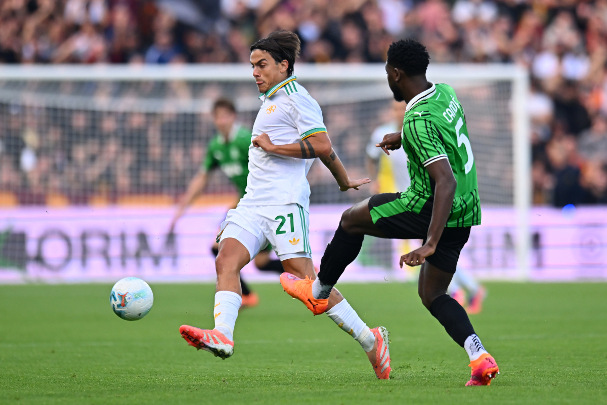 SASSUOLO, ITALY - OCTOBER 26: Paulo Dybala of AS Roma challenges Fali Cande of Sassuolo as he passes the ball during the Serie A match between US Sassuolo Calcio and AS Roma at Mapei Stadium Citta del Tricolore on October 26, 2025 in Sassuolo, Italy. (Photo by Alessandro Sabattini/Getty Images)