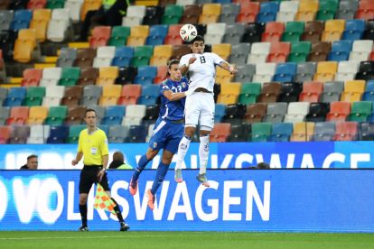 UDINE, ITALY - OCTOBER 14: Anan Khalaili of Israel wins a header from Riccardo Calafiori of Italy during the FIFA World Cup 2026 qualifier match between Italy and Israel at Stadio Friuli on October 14, 2025 in Udine, Italy. (Photo by Marco Luzzani/Getty Images)