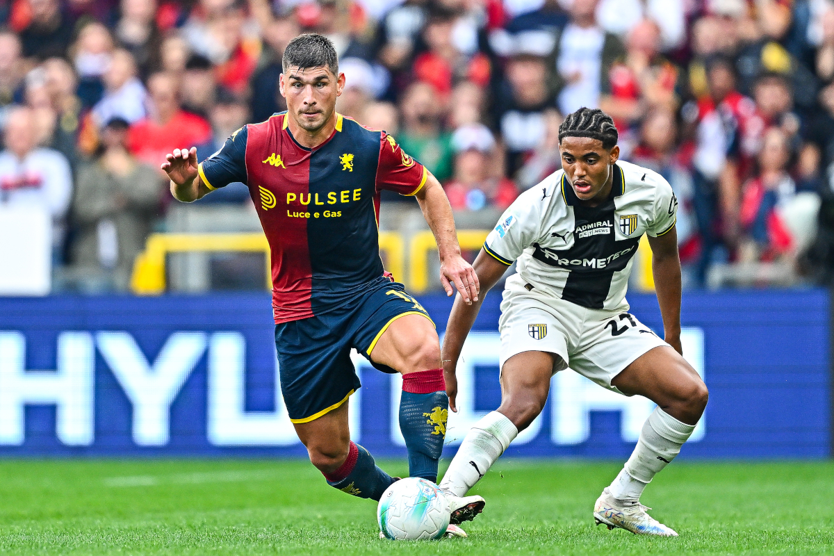 GENOA, ITALY - OCTOBER 19: Ruslan Malinovskyi of Genoa (left) and Sascha Britschgi of Parma vie for the ball during the Serie A match between Genoa CFC and Parma Calcio 1913 at Stadio Luigi Ferraris on October 19, 2025 in Genoa, Italy. (Photo by Simone Arveda/Getty Images)