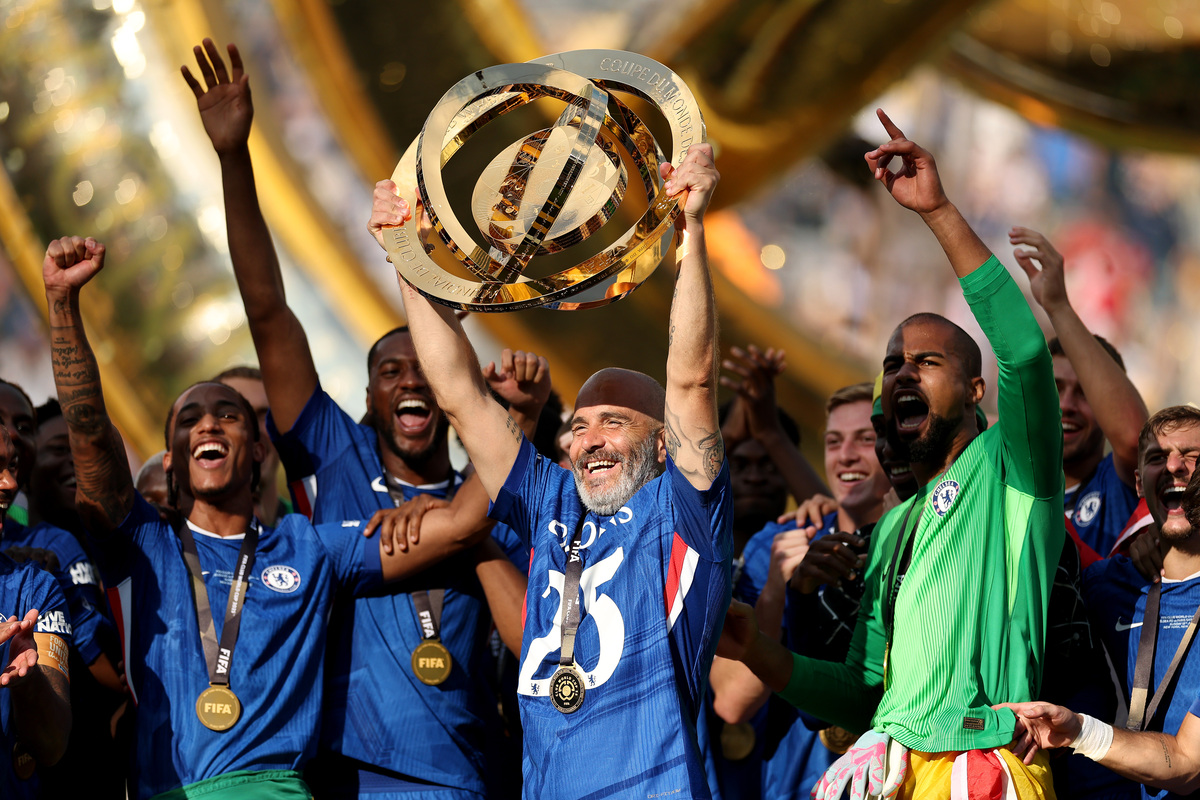 Enzo Maresca, Head Coach of Chelsea FC, lifts the FIFA Club World Cup trophy after his team`s victory.