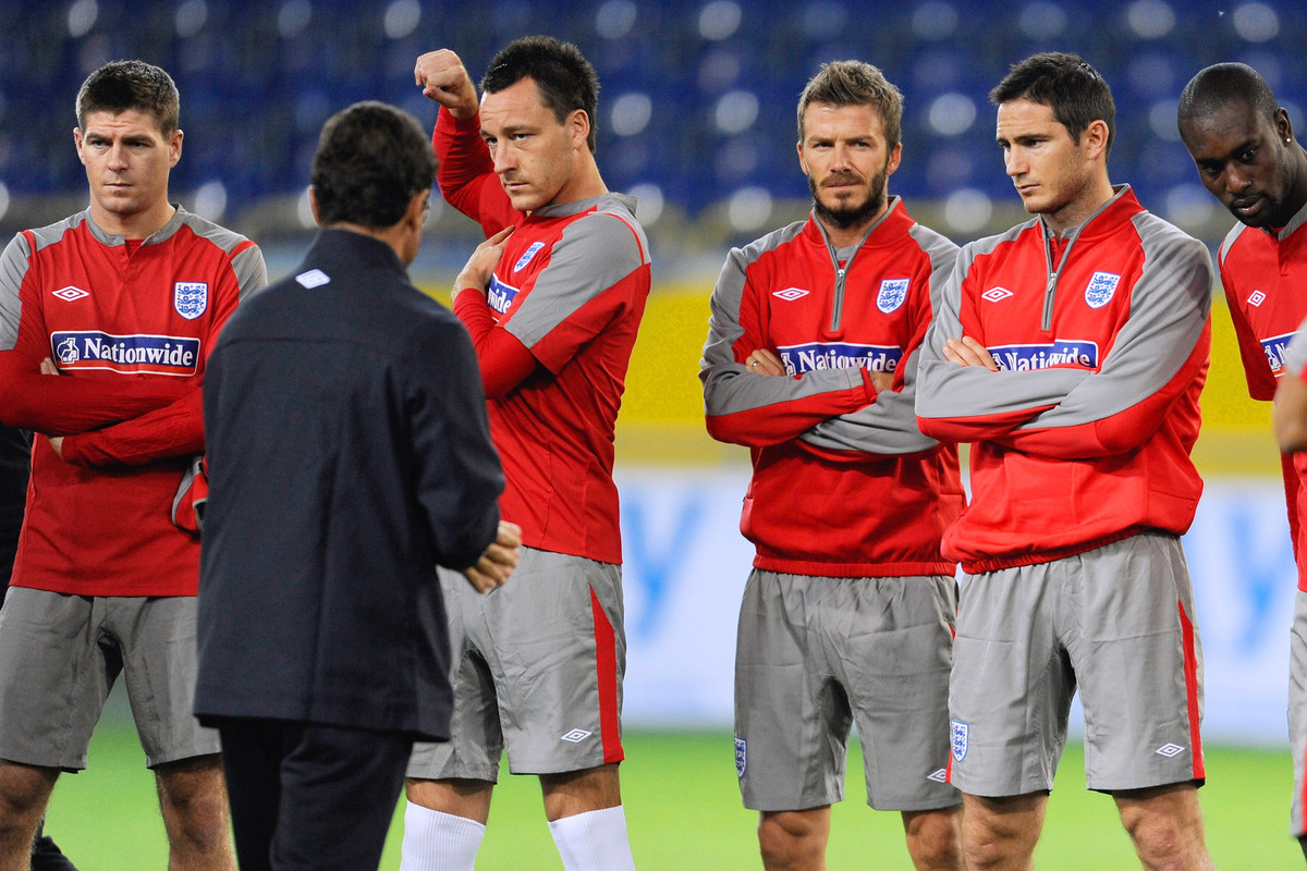 DNEPROPETROVSK, UKRAINE - OCTOBER 09: (L-R) Steven Gerrard, captain John Terry, David Beckham and Frank Lampard listen to manager Fabio Capello during an England training session at the Dnipro Arena on October 9, 2009 in Dnepropetrovsk, Ukraine. (Photo by Michael Regan/Getty Images)