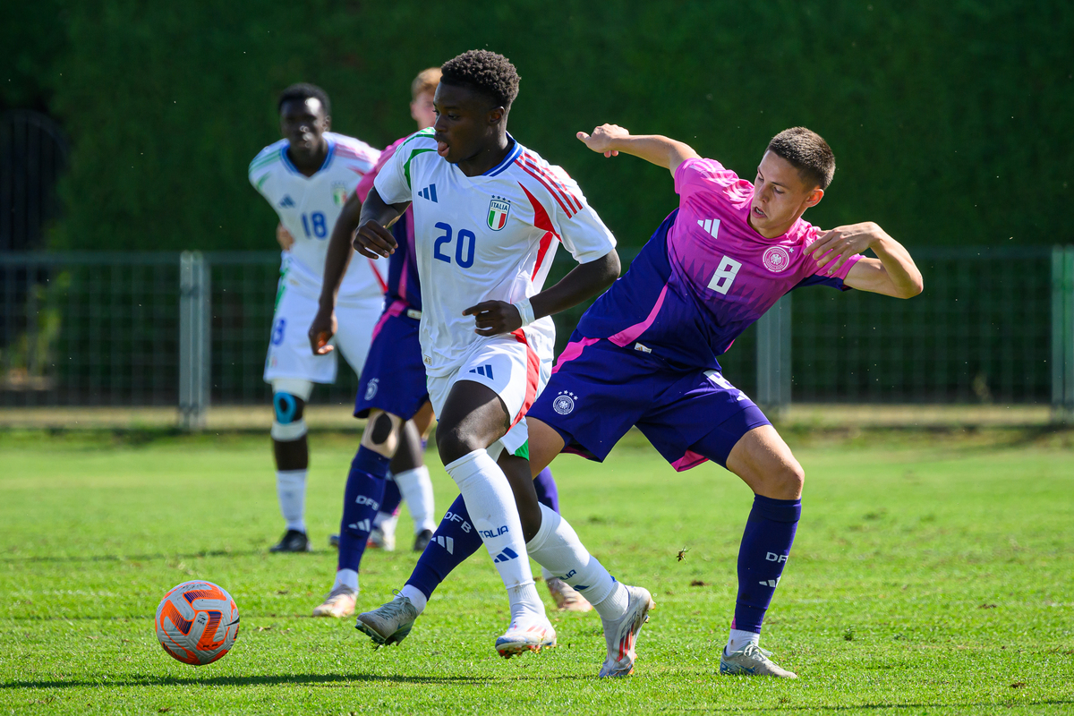 LUDBREG, CROATIA - SEPTEMBER 7: Bence Dardai (R) of U19 Germany challenges Alphadjo Cisse of U19 Italy during the UEFA Under-19 Football Friendly Match between U19 Germany and U19 Italy at NK Podravina Stadium on September 7, 2024 in Ludbreg, Croatia. (Photo by Jure Makovec/Getty Images for DFB)