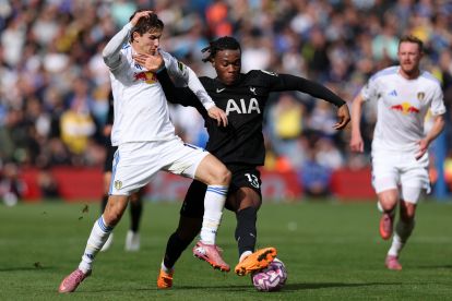 LEEDS, ENGLAND - OCTOBER 04: Destiny Udogie of Tottenham Hotspur is challenged by Brenden Aaronson of Leeds United during the Premier League match between Leeds United and Tottenham Hotspur at Elland Road on October 04, 2025 in Leeds, England. (Photo by Stu Forster/Getty Images)