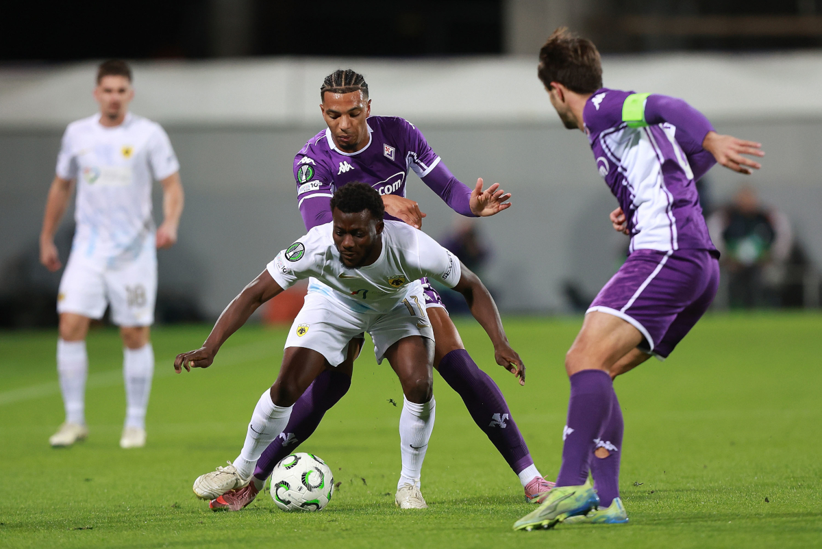 FLORENCE, ITALY - NOVEMBER 27: Cher Ndour of ACF Fiorentina battles for the ball with Aboubakary Koita of AEK Athens FC during the UEFA Conference League 2025/26 League Phase MD4 match between ACF Fiorentina and AEK Athens FC at Stadio Artemio Franchi on November 27, 2025 in Florence, Italy. (Photo by Gabriele Maltinti/Getty Images)
