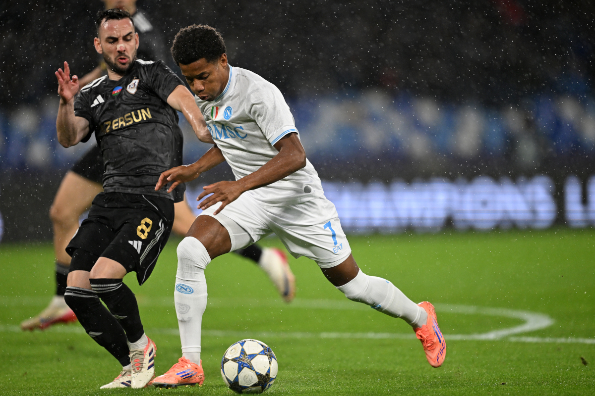 NAPLES, ITALY - NOVEMBER 25: David Neres of SSC Napoli battles for possession with Marko Jankovic of Quarabag FK during the UEFA Champions League 2025/26 League Phase MD5 match between SSC Napoli and Qarabag FK at Stadio Diego Armando Maradona on November 25, 2025 in Naples, Italy. (Photo by Francesco Pecoraro/Getty Images)