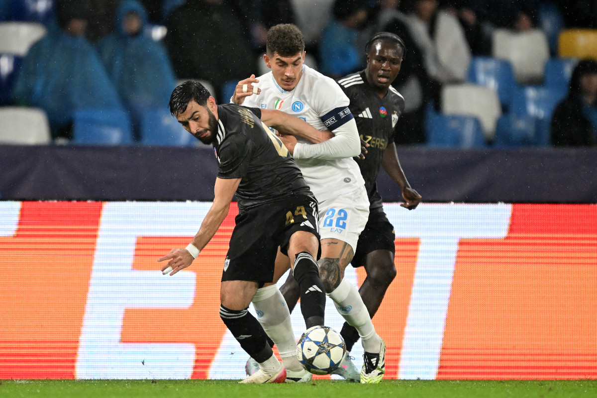 NAPLES, ITALY - NOVEMBER 25: Elvin Jafarguliyev of Quarabag FK battles for possession with Giovanni Di Lorenzo of SSC Napoli during the UEFA Champions League 2025/26 League Phase MD5 match between SSC Napoli and Qarabag FK at Stadio Diego Armando Maradona on November 25, 2025 in Naples, Italy. (Photo by Francesco Pecoraro/Getty Images)