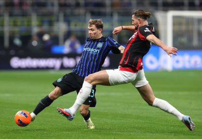 MILAN, ITALY - NOVEMBER 23: Nicolo’ Barella of FC Internazionale is challenged by Adrien Rabiot of AC Milan during the Serie A match between FC Internazionale and AC Milan at Giuseppe Meazza Stadium on November 23, 2025 in Milan, Italy. (Photo by Marco Luzzani/Getty Images)