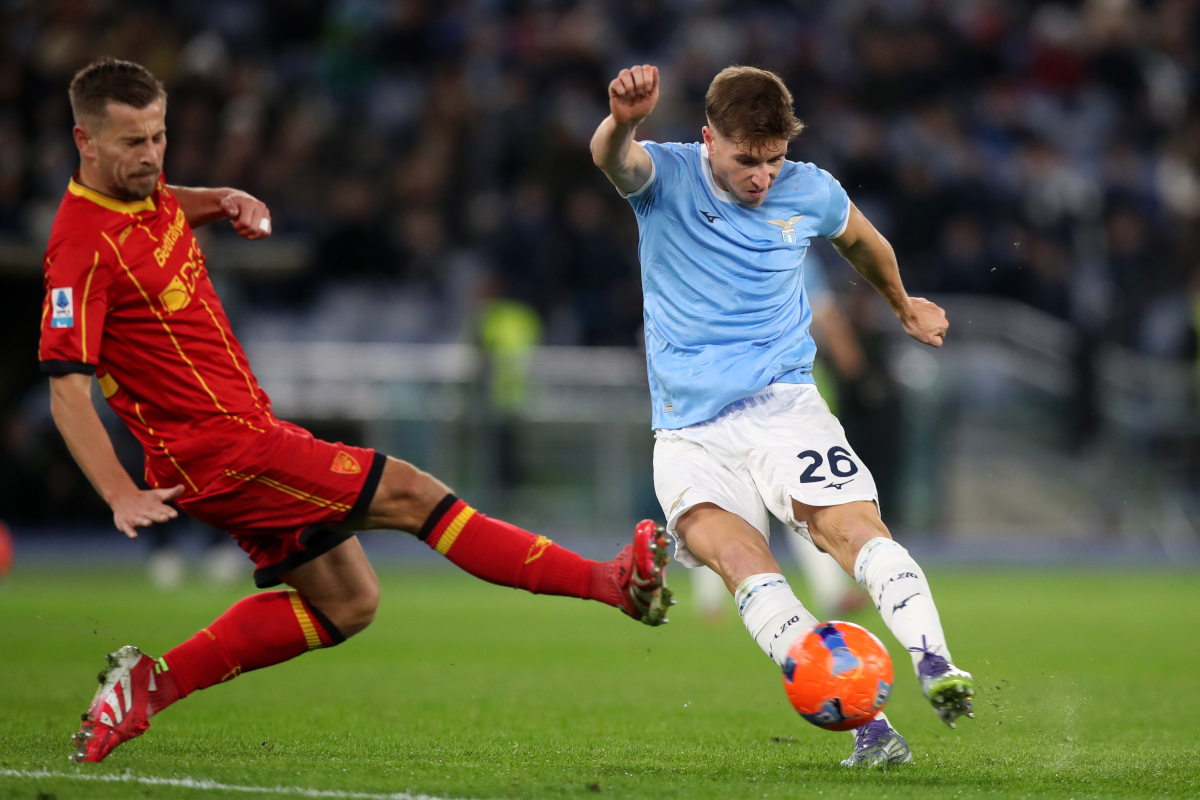 ROME, ITALY - NOVEMBER 23: Toma Basic of Lazio shoots past Ylber Ramadani of Lecce during the Serie A match between SS Lazio and US Lecce at Stadio Olimpico on November 23, 2025 in Rome, Italy. (Photo by Paolo Bruno/Getty Images)