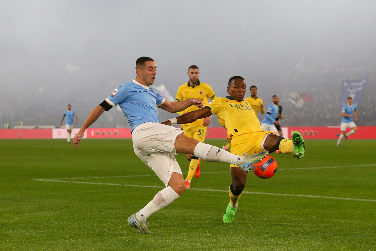 ROME, ITALY - DECEMBER 04: Adam Marusic of Lazio battles for possession with Pervis Estupinan of AC Milan during the Coppa Italia Round of 16 match between SS Lazio and AC Milan at Olimpico Stadium on December 04, 2025 in Rome, Italy. (Photo by Paolo Bruno/Getty Images)