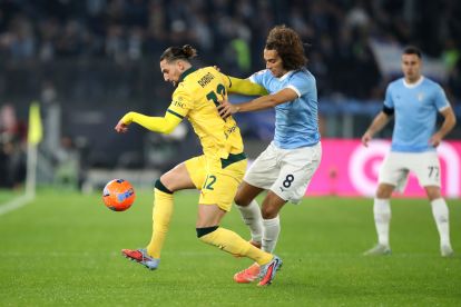 ROME, ITALY - DECEMBER 04: Adrien Rabiot of AC Milan is challenged by Matteo Guendouzi of Lazio during the Coppa Italia Round of 16 match between SS Lazio and AC Milan at Olimpico Stadium on December 04, 2025 in Rome, Italy. (Photo by Paolo Bruno/Getty Images)
