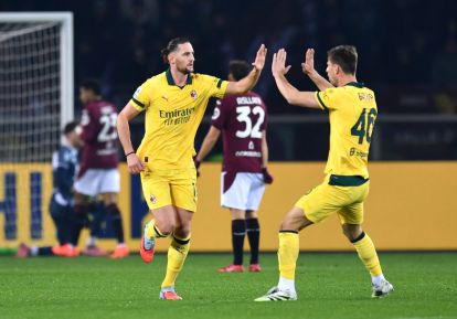 TURIN, ITALY - DECEMBER 08: Adrien Rabiot of AC Milan celebrates scoring his team's first goal with teammate Matteo Gabbia during the Serie A match between Torino FC and AC Milan at Stadio Olimpico di Torino on December 08, 2025 in Turin, Italy. (Photo by Valerio Pennicino/Getty Images)