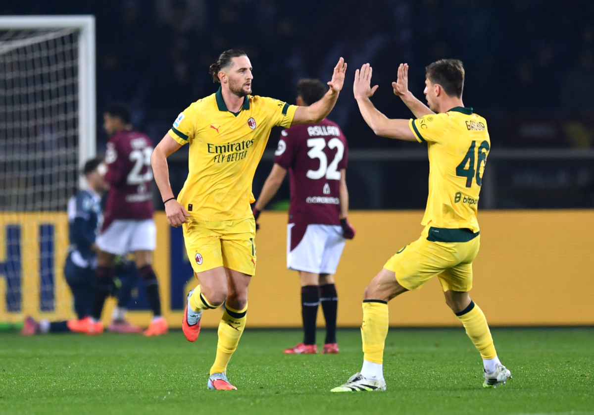 TURIN, ITALY - DECEMBER 08: Adrien Rabiot of AC Milan celebrates scoring his team's first goal with teammate Matteo Gabbia during the Serie A match between Torino FC and AC Milan at Stadio Olimpico di Torino on December 08, 2025 in Turin, Italy. (Photo by Valerio Pennicino/Getty Images)