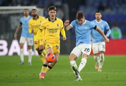 ROME, ITALY - DECEMBER 04: Toma Basic of Lazio passes the ball whilst under pressure from Alexis Saelemaekers of AC Milan during the Coppa Italia Round of 16 match between SS Lazio and AC Milan at Olimpico Stadium on December 04, 2025 in Rome, Italy. (Photo by Paolo Bruno/Getty Images)