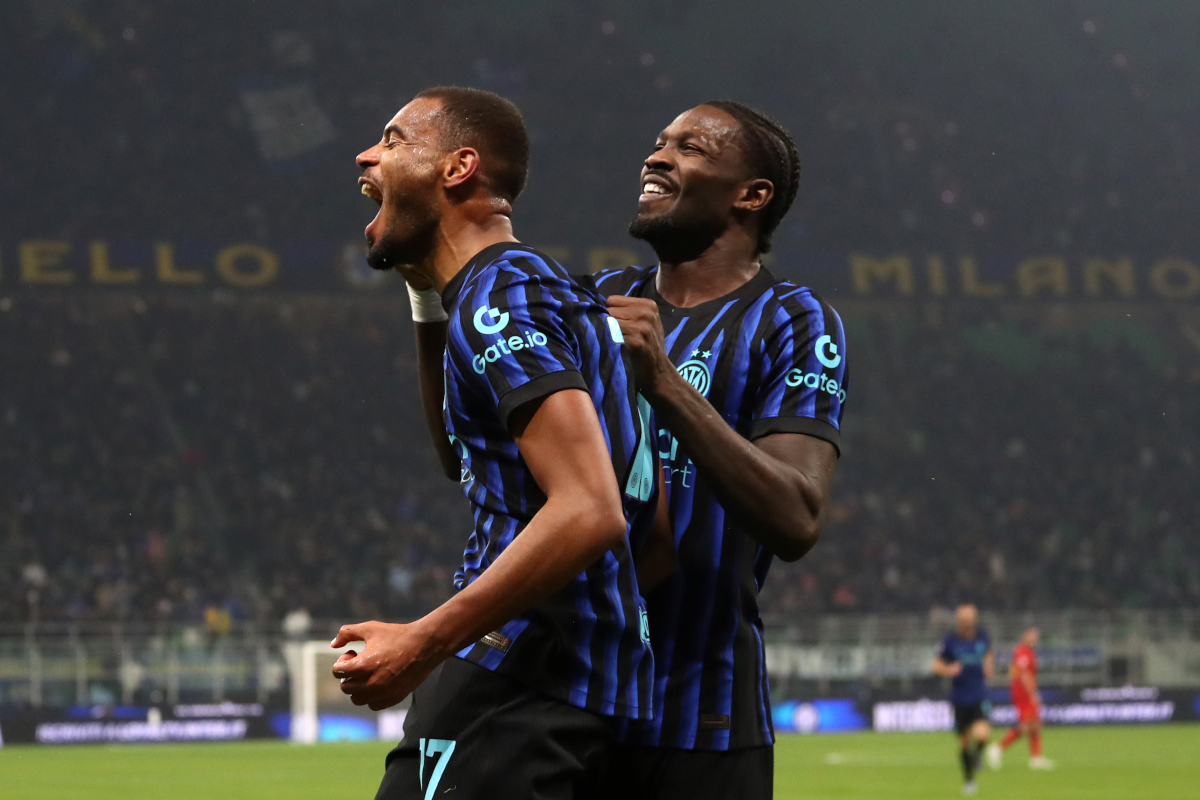 MILAN, ITALY - DECEMBER 03: Andy Diouf of FC Internazionale Milano celebrates scoring his team's first goal with teammate Marcus Thuram during the Coppa Italia round of 16 match between FC Internazionale and Venezia FC at San Siro Stadium on December 03, 2025 in Milan, Italy. (Photo by Marco Luzzani/Getty Images)