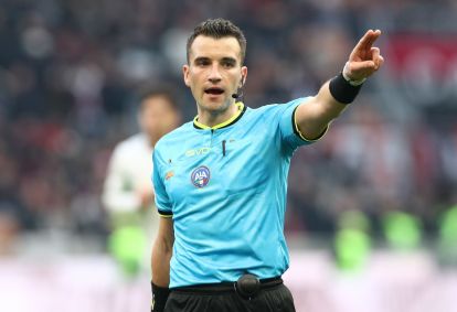 MILAN, ITALY - DECEMBER 14: Referee Davide Crezzini gestures during the Serie A match between AC Milan and US Sassuolo Calcio at Giuseppe Meazza Stadium on December 14, 2025 in Milan, Italy. (Photo by Marco Luzzani/Getty Images)