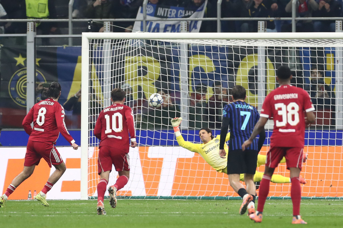 MILAN, ITALY - DECEMBER 09: Dominik Szoboszlai of Liverpool FC scores their team's first goal during the UEFA Champions League 2025/26 League Phase MD6 match between FC Internazionale Milano and Liverpool FC at Stadio San Siro on December 09, 2025 in Milan, Italy. (Photo by Marco Luzzani/Getty Images)