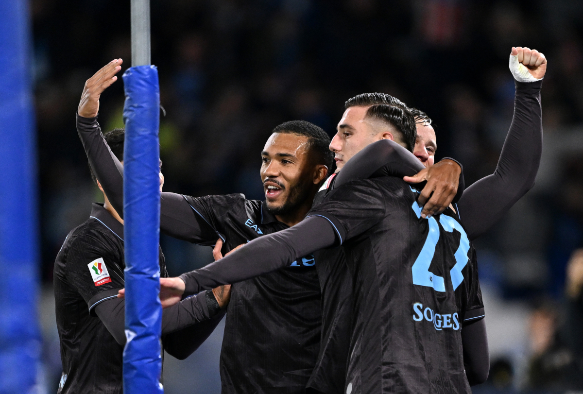 NAPLES, ITALY - DECEMBER 03: Lorenzo Lucca of SSC Napoli celebrates scoring his team's first goal with teammates during the Coppa Italia round of 16 match between SCC Napoli and Cagliari Calcio at Stadio Diego Armando Maradona on December 03, 2025 in Naples, Italy. (Photo by Francesco Pecoraro/Getty Images)