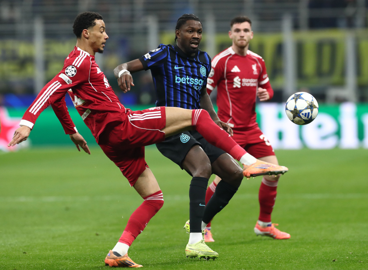 MILAN, ITALY - DECEMBER 09: Marcus Thuram of FC Internazionale competes for the ball with Hugo Ekitike’ of Liverpool FC during the UEFA Champions League 2025/26 League Phase MD6 match between FC Internazionale Milano and Liverpool FC at Stadio San Siro on December 09, 2025 in Milan, Italy. (Photo by Marco Luzzani/Getty Images)