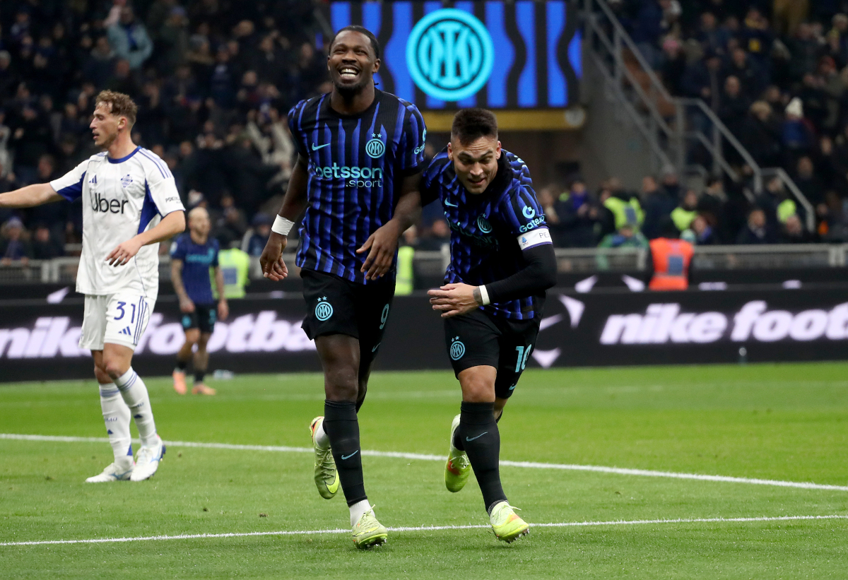 MILAN, ITALY - DECEMBER 06: Marcus Thuram of FC Internazionale Milano celebrates scoring his team's second goal with teammate Lautaro Martinez during the Serie A match between FC Internazionale and Como 1907 at Giuseppe Meazza Stadium on December 06, 2025 in Milan, Italy. (Photo by Marco Luzzani/Getty Images)