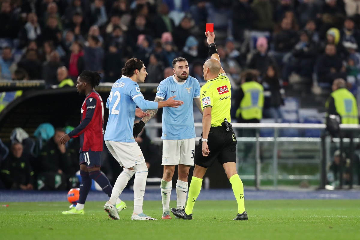ROME, ITALY - DECEMBER 07: Mario Gila of Lazio is shown a red card by referee, Michael Fabbri during the Serie A match between SS Lazio and Bologna FC 1909 at Stadio Olimpico on December 07, 2025 in Rome, Italy. (Photo by Paolo Bruno/Getty Images)