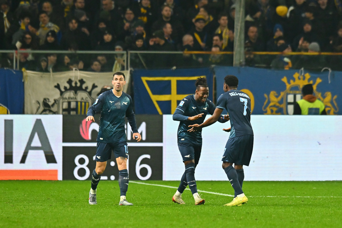 PARMA, ITALY - DECEMBER 13: Tijjani Noslin of Lazio (C) celebrates scoring his team's first goal with teammate Fisayo Dele-Bashiru (R) during the Serie A match between Parma Calcio 1913 and SS Lazio at Stadio Ennio Tardini on December 13, 2025 in Parma, Italy. (Photo by Alessandro Sabattini/Getty Images)
