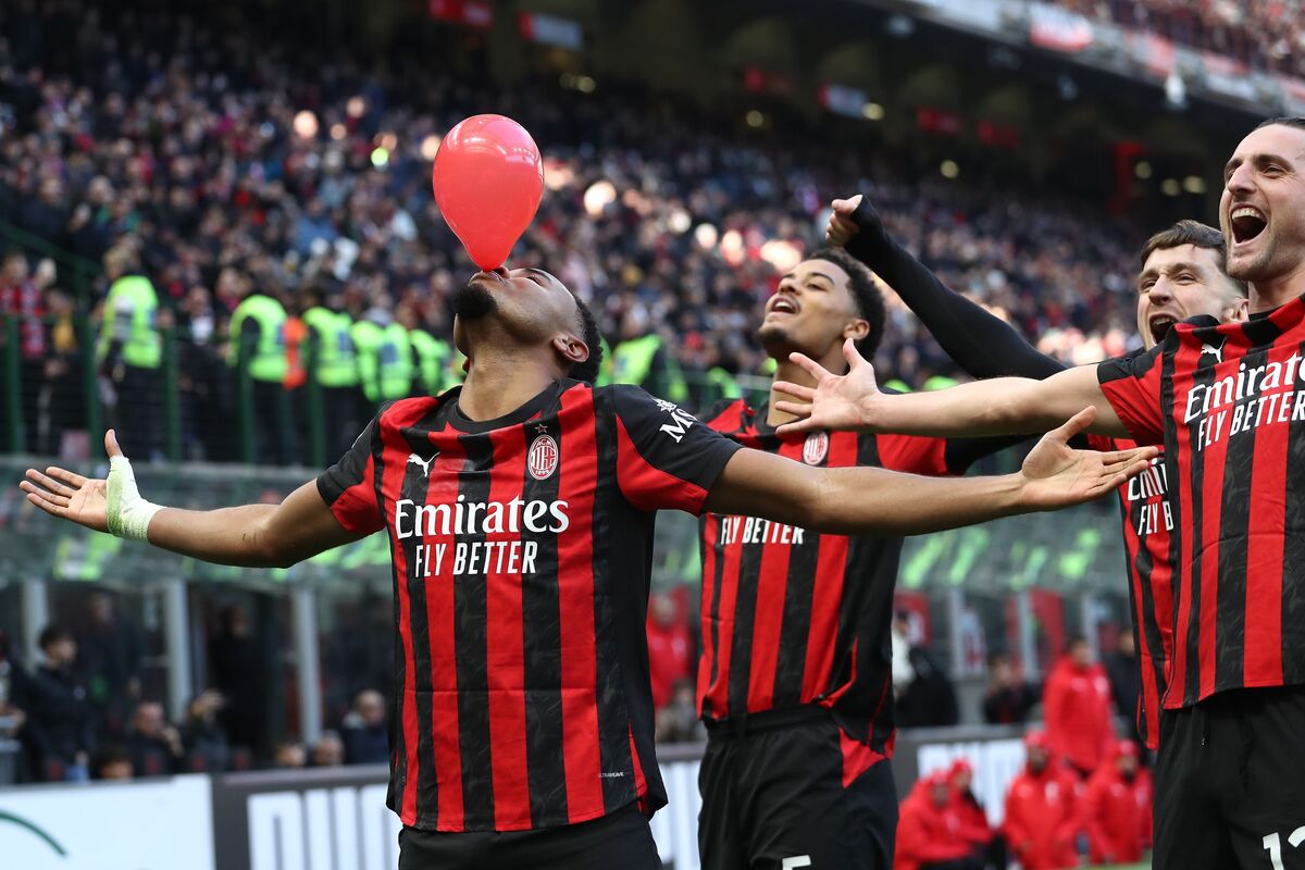 MILAN, ITALY - DECEMBER 28: Christopher Nkunku of AC Milan celebrates after scoring their team's second goal from the penalty spot during the Serie A match between AC Milan and Hellas Verona FC at Giuseppe Meazza Stadium on December 28, 2025 in Milan, Italy. (Photo by Marco Luzzani/Getty Images)