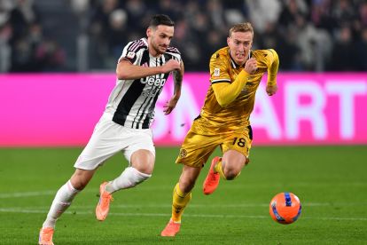 TURIN, ITALY - DECEMBER 02: Federico Gatti of Juventus runs with the ball while put under pressure by Adam Buksa of Udinese Calcio during the Serie C match between Ternana Calcio and Juventus Next Gen at Allianz Stadium on December 02, 2025 in Turin, Italy. (Photo by Valerio Pennicino/Getty Images)