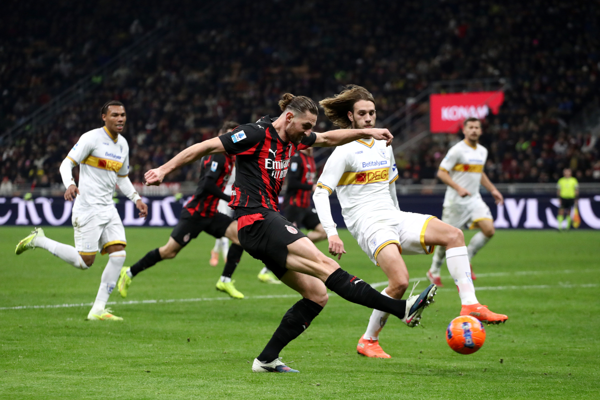MILAN, ITALY - JANUARY 18: Adrien Rabiot of AC Milan shoots whilst under pressure from Antonino Gallo of US Lecce during the Serie A match between AC Milan and US Lecce at Giuseppe Meazza Stadium on January 18, 2026 in Milan, Italy. (Photo by Marco Luzzani/Getty Images)