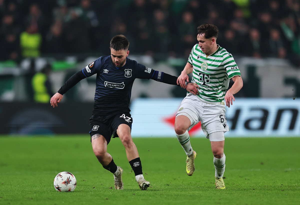 BUDAPEST, HUNGARY - DECEMBER 11: Djeidi Gassama of Rangers is challenged by Alex Toth of Ferencvarosi TC during the UEFA Europa League 2025/26 League Phase MD6 match between Ferencvarosi TC and Rangers FC at Ferencvaros Stadion on December 11, 2025 in Budapest, Hungary. (Photo by David Balogh/Getty Images)