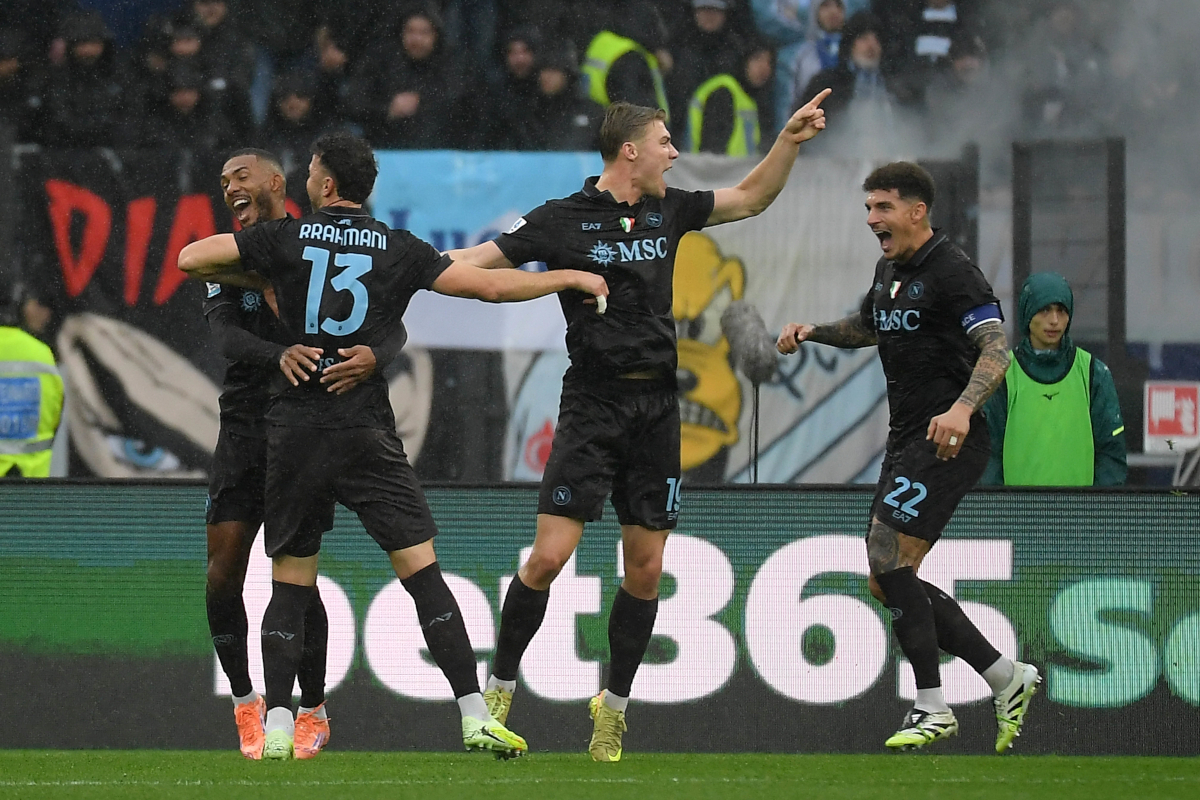 ROME, ITALY - JANUARY 04: Amir Rrahmani of SSC Napoli celebrates after scoring his team's second goal with his teammates during the Serie A match between SS Lazio and SSC Napoli at Stadio Olimpico on January 04, 2026 in Rome, Italy. (Photo by Marco Rosi - SS Lazio/Getty Images)