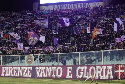 FLORENCE, ITALY - JANUARY 27: Fans of ACF Fiorentina cheer their team during of the Coppa Italia match between of ACF Fiorentina and of Como 1907 at Stadio Artemio Franchi on January 27, 2026 in Florence, Italy. (Photo by Gabriele Maltinti/Getty Images)