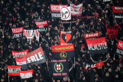 ROME, ITALY - JANUARY 25: The fans of AC Milan show their support as they hold flags prior to the Serie A match between AS Roma and AC Milan at Stadio Olimpico on January 25, 2026 in Rome, Italy. (Photo by Paolo Bruno/Getty Images)