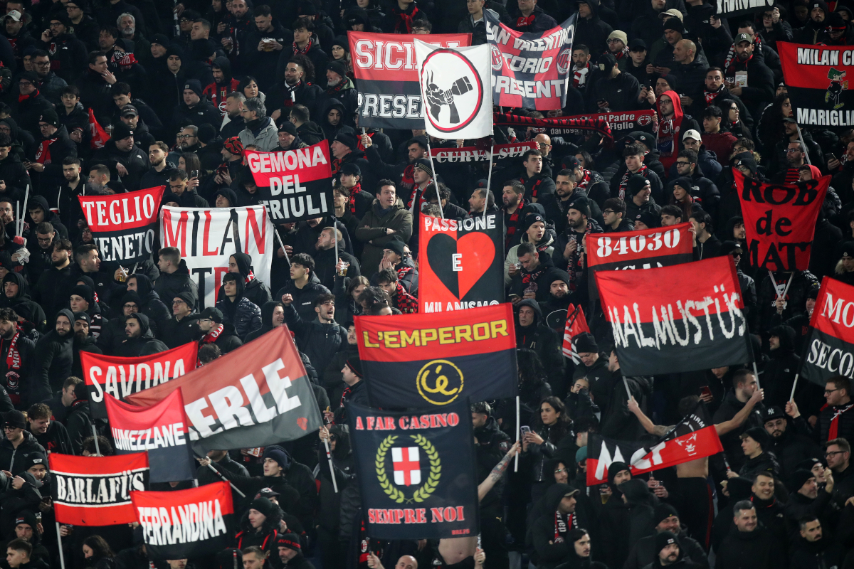 ROME, ITALY - JANUARY 25: The fans of AC Milan show their support as they hold flags prior to the Serie A match between AS Roma and AC Milan at Stadio Olimpico on January 25, 2026 in Rome, Italy. (Photo by Paolo Bruno/Getty Images)