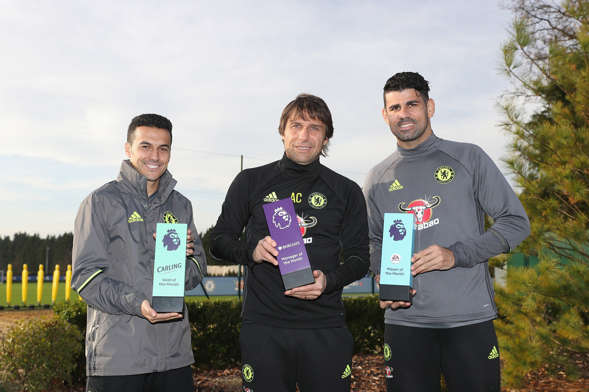 COBHAM, ENGLAND - DECEMBER 09: Pedro, Manager Antonio Conte and Diego Costa pose with their awards as they receive the Monthly Premier League Awards at Chelsea Training Ground on December 9, 2016 in Cobham, England. (Photo by Christopher Lee/Getty Images for Premier League)