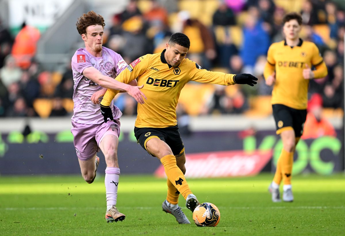 WOLVERHAMPTON, ENGLAND - JANUARY 10: Joao Gomes of Wolverhampton Wanderers is challenged by Tommy McDermott of Shrewsbury Town during the Emirates FA Cup Third Round match between Wolverhampton Wanderers and Shrewsbury Town on January 10, 2026 in Wolverhampton, England. (Photo by Shaun Botterill/Getty Images)