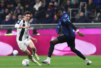 MILAN, ITALY - FEBRUARY 14: Andrea Cambiaso of Juventus is challenged by Yann Aurel Bisseck of FC Internazionale Milano during the Serie A match between FC Internazionale and Juventus FC at Giuseppe Meazza Stadium on February 14, 2026 in Milan, Italy. (Photo by Marco Luzzani/Getty Images)