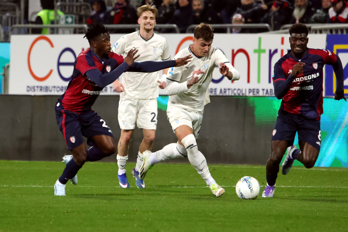 CAGLIARI, ITALY - FEBRUARY 21: Ibrahim Sulemana and Michel Adopo of Cagliari in contrast with Daniel Maldini of Lazio during the Serie A match between Cagliari Calcio and SS Lazio at Stadio Sant'Elia on February 21, 2026 in Cagliari, Italy. (Photo by Enrico Locci/Getty Images)