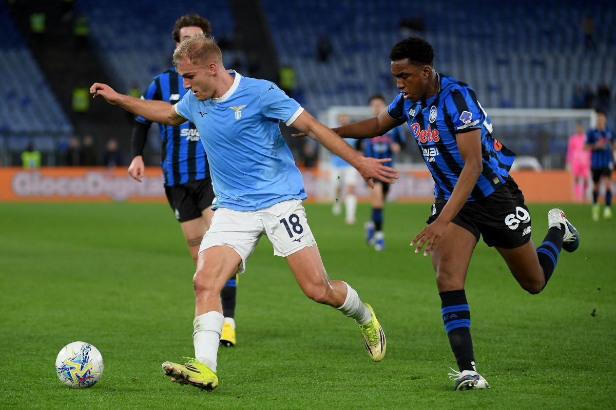 ROME, ITALY - FEBRUARY 14: Gustav Isaksen of SS Lazio competes for the ball with Honest Ahanor of Atalanta BC during the Serie A match between SS Lazio and Atalanta BC at Stadio Olimpico on February 14, 2026 in Rome, Italy. (Photo by Marco Rosi - SS Lazio/Getty Images)