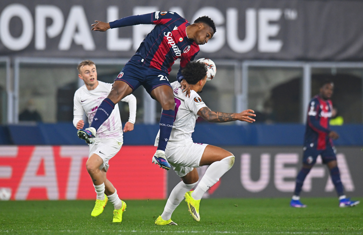BOLOGNA, ITALY - FEBRUARY 26: Noah Holm of SK Brann is challenged by Jhon Lucumi of Bologna during the UEFA Europa League 2025/26 Knockout Play-off Second Leg match between Bologna FC 1909 and SK Brann at Stadio Renato Dall'Ara on February 26, 2026 in Bologna, Italy. (Photo by Alessandro Sabattini/Getty Images)