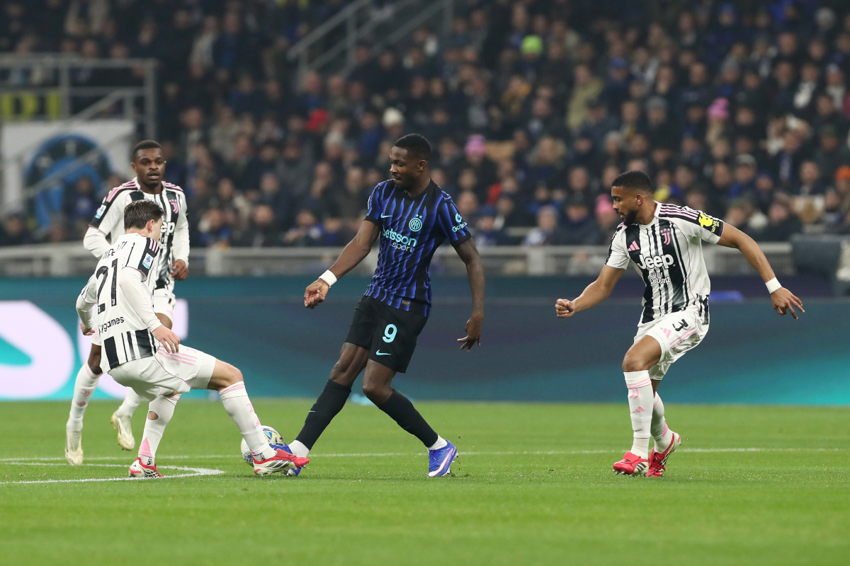 MILAN, ITALY - FEBRUARY 14: Fabio Miretti of Juventus and Marcus Thuram of FC Internazionale Milano battle for possession during the Serie A match between FC Internazionale and Juventus FC at Giuseppe Meazza Stadium on February 14, 2026 in Milan, Italy. (Photo by Marco Luzzani/Getty Images)