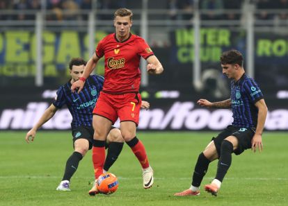 MILAN, ITALY - DECEMBER 03: Daniel Fila of Venezia FC is challenged by Matteo Cocchi and Carlos Augusto of FC Internazionale during the Coppa Italia match between FC Internazionale and Venezia FC at San Siro Stadium on December 03, 2025 in Milan, Italy. (Photo by Marco Luzzani/Getty Images)