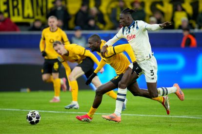 DORTMUND, GERMANY - FEBRUARY 17: Serhou Guirassy of Borussia Dortmund is challenged by Odilon Kossounou of Atalanta during the UEFA Champions League 2025/26 League Knockout Play-off First Leg match between Borussia Dortmund and Atalanta BC at BVB Stadion Dortmund on February 17, 2026 in Dortmund, Germany. (Photo by Pau Barrena/Getty Images)