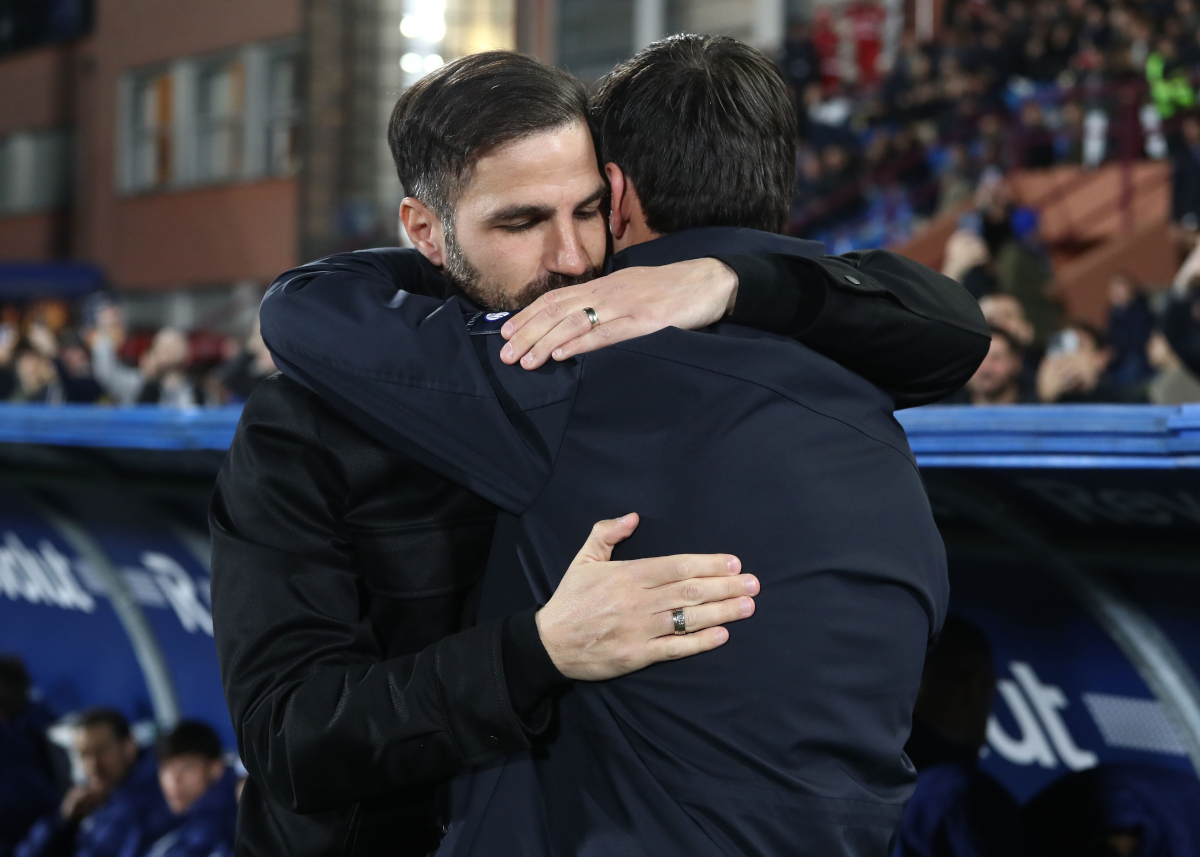 COMO, ITALY - MARCH 03: Como 1907 coach Cesc Fabregas embraces FC Internazionale coach Cristian Chivu during the Coppa Italia match between Como 1907 and FC Internazionale at Giuseppe Sinigaglia Stadium on March 03, 2026 in Como, Italy. (Photo by Marco Luzzani/Getty Images)