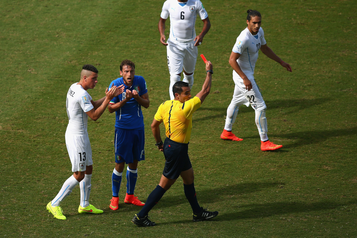 NATAL, BRAZIL - JUNE 24: Referee Marco Rodriguez shows a red card to Claudio Marchisio of Italy during the 2014 FIFA World Cup Brazil Group D match between Italy and Uruguay at Estadio das Dunas on June 24, 2014 in Natal, Brazil. (Photo by Julian Finney/Getty Images)
