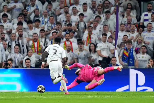 MADRID, SPAIN - MARCH 11: Vinicius Junior of Real Madrid is fouled by Gianluigi Donnarumma of Manchester City which leads to a penalty to Real Madrid during the UEFA Champions League 2025/26 Round of 16 First Leg match between Real Madrid CF and Manchester City FC at Estadio Santiago Bernabeu on March 11, 2026 in Madrid, Spain. (Photo by Angel Martinez/Getty Images)