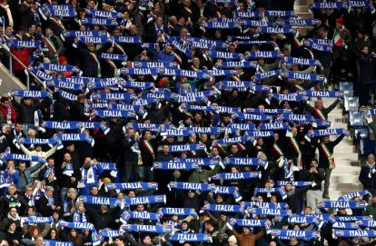 BERGAMO, ITALY - MARCH 26: Fans of Italy show their support by holding up scarves in the stands prior to the FIFA World Cup 2026 European Qualifiers KO play-offs match between Italy and Northern Ireland at Stadio di Bergamo on March 26, 2026 in Bergamo, Italy. (Photo by Marco Luzzani/Getty Images)