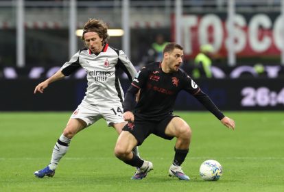 MILAN, ITALY - MARCH 21: Nikola Vlasic of Torino is challenged by Luka Modric of AC Milan during the Serie A match between AC Milan and Torino FC at Giuseppe Meazza Stadium on March 21, 2026 in Milan, Italy. (Photo by Marco Luzzani/Getty Images)