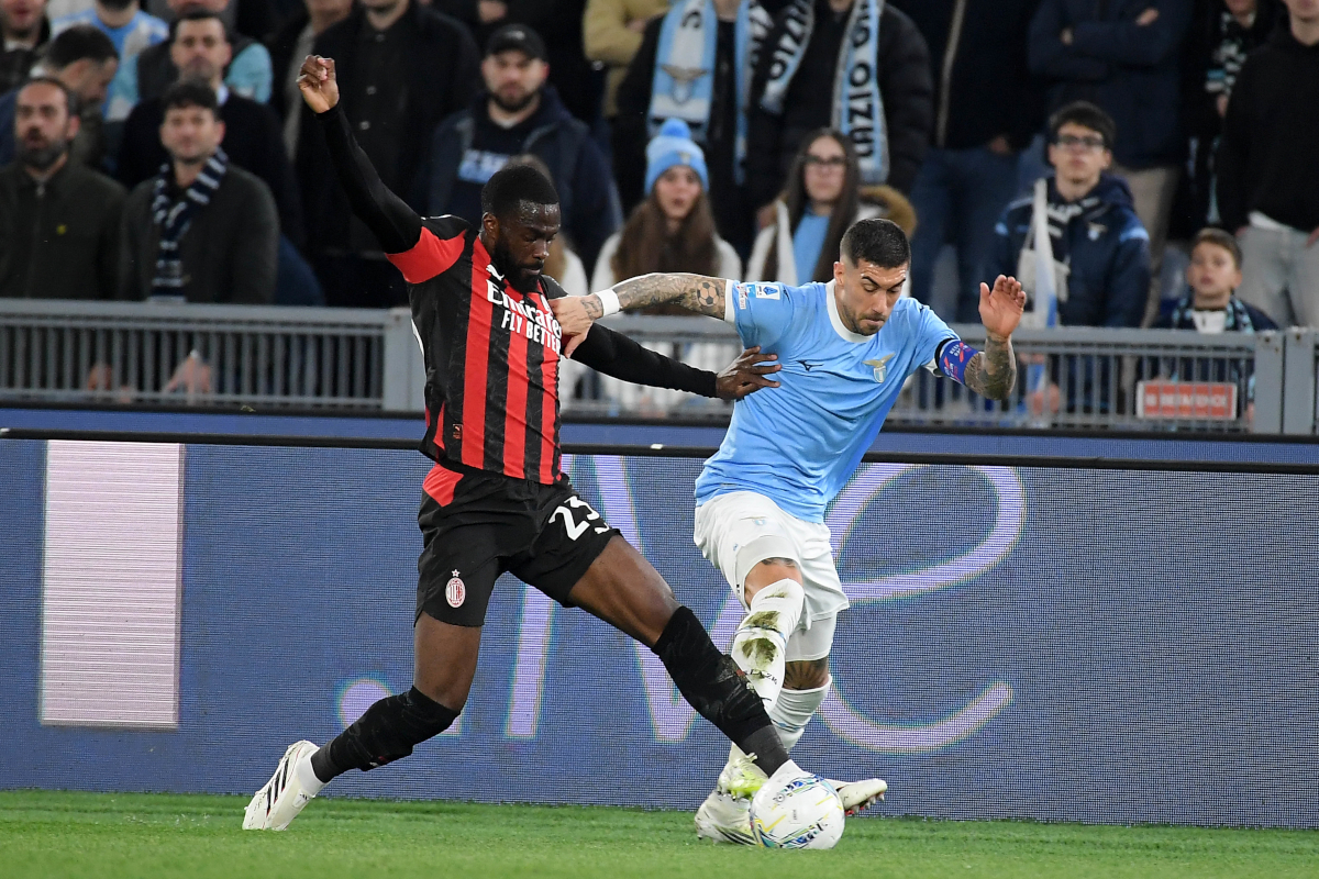 ROME, ITALY - MARCH 15: Mattia Zaccagni of SS Lazio competes for the ball with Fikayo Tomori of AC MIlan during the Serie A match between SS Lazio and AC Milan at Stadio Olimpico on March 15, 2026 in Rome, Italy. (Photo by Marco Rosi - SS Lazio/Getty Images)