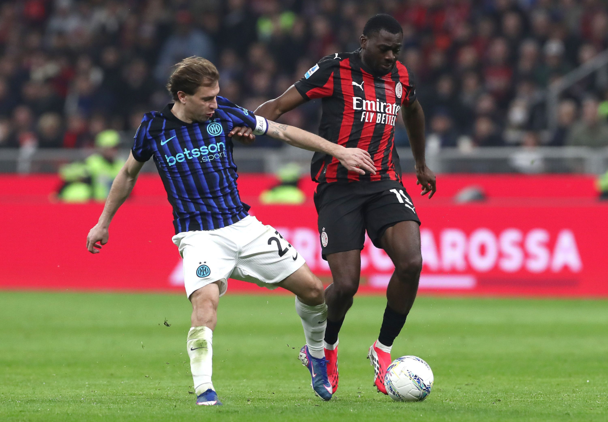MILAN, ITALY - MARCH 08: Youssouf Fofana of AC Milan competes for the ball with Nicolo’ Barella of Inter during the Serie A match between AC Milan and FC Internazionale at Giuseppe Meazza Stadium on March 08, 2026 in Milan, Italy. (Photo by Marco Luzzani/Getty Images)