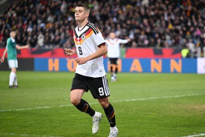 BRAUNSCHWEIG, GERMANY - MARCH 27: Nicolo Tresoldi of Germany celebrates scoring his team's second goal during the UEFA Under21 EURO Qualifier between Germany U21 and Northern Ireland U21 at Eintracht Stadion on March 27, 2026 in Braunschweig, Germany. (Photo by Stuart Franklin/Getty Images)
